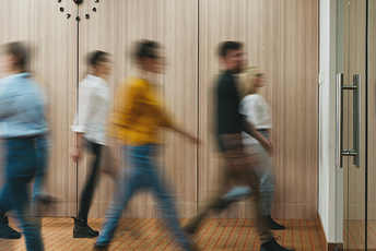 a decorative element: people walking in the office